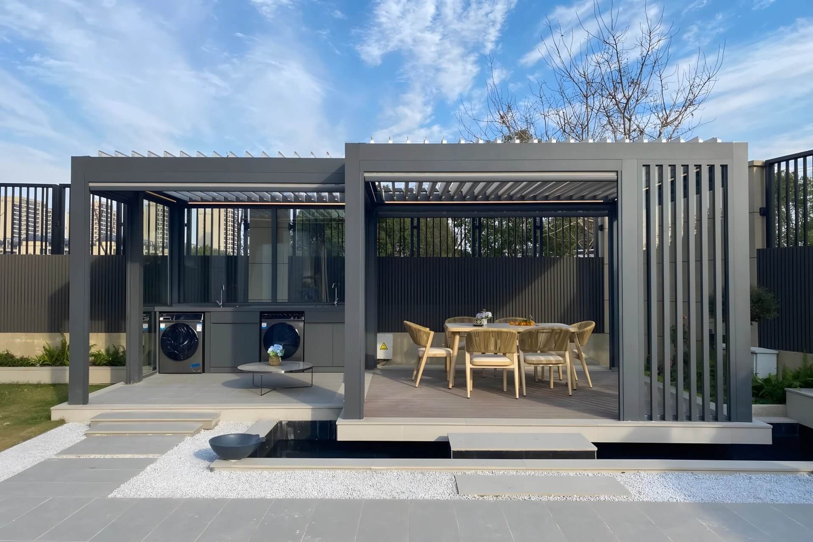 Collaborative product development team discussing a complex 3D CAD model of a motorized aluminum outdoor structure on a laptop, reflecting our focus on market trends and innovation.