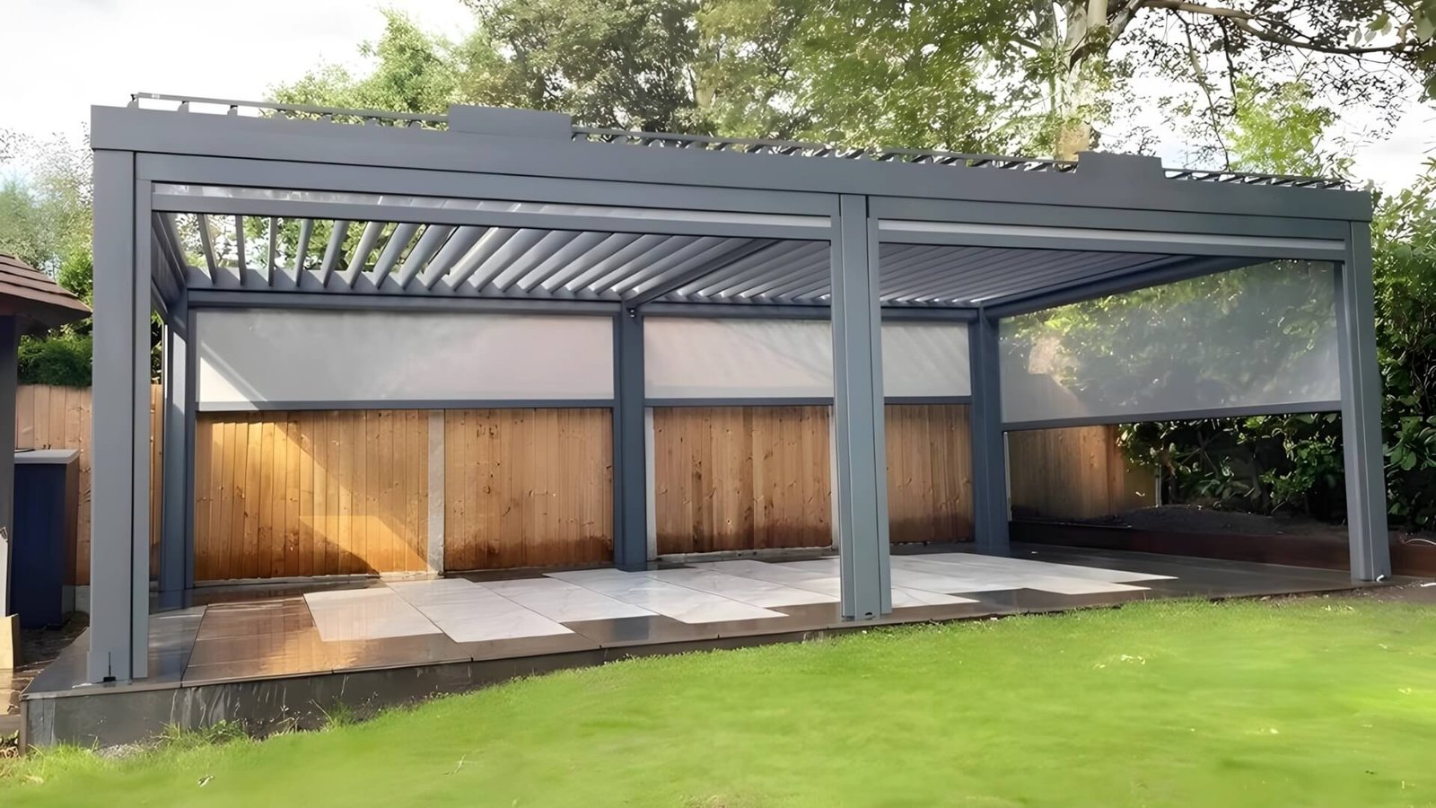 Internal view of Oude Outdoor's large-scale aluminum structure manufacturing facility with neatly stacked raw materials and overhead cranes, demonstrating production capacity for pergolas and carports.