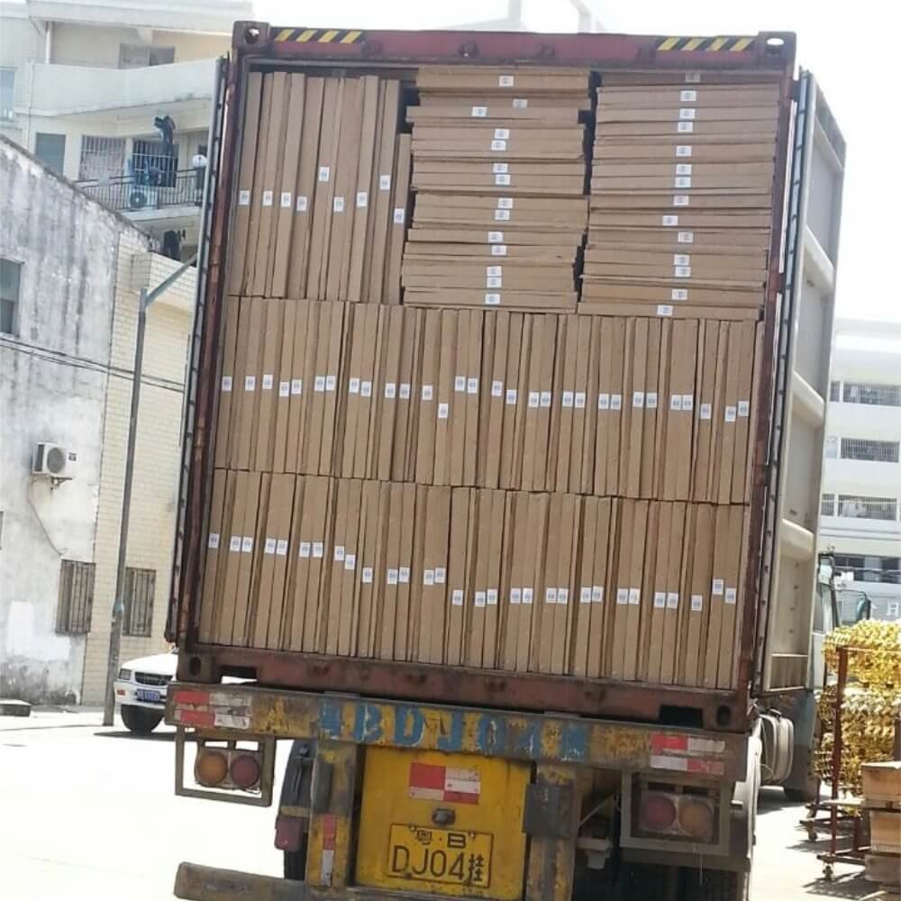 A standard shipping container fully loaded with neatly stacked flat-pack cartons of aluminum outdoor structures, demonstrating efficient space utilization and high-volume export capacity.