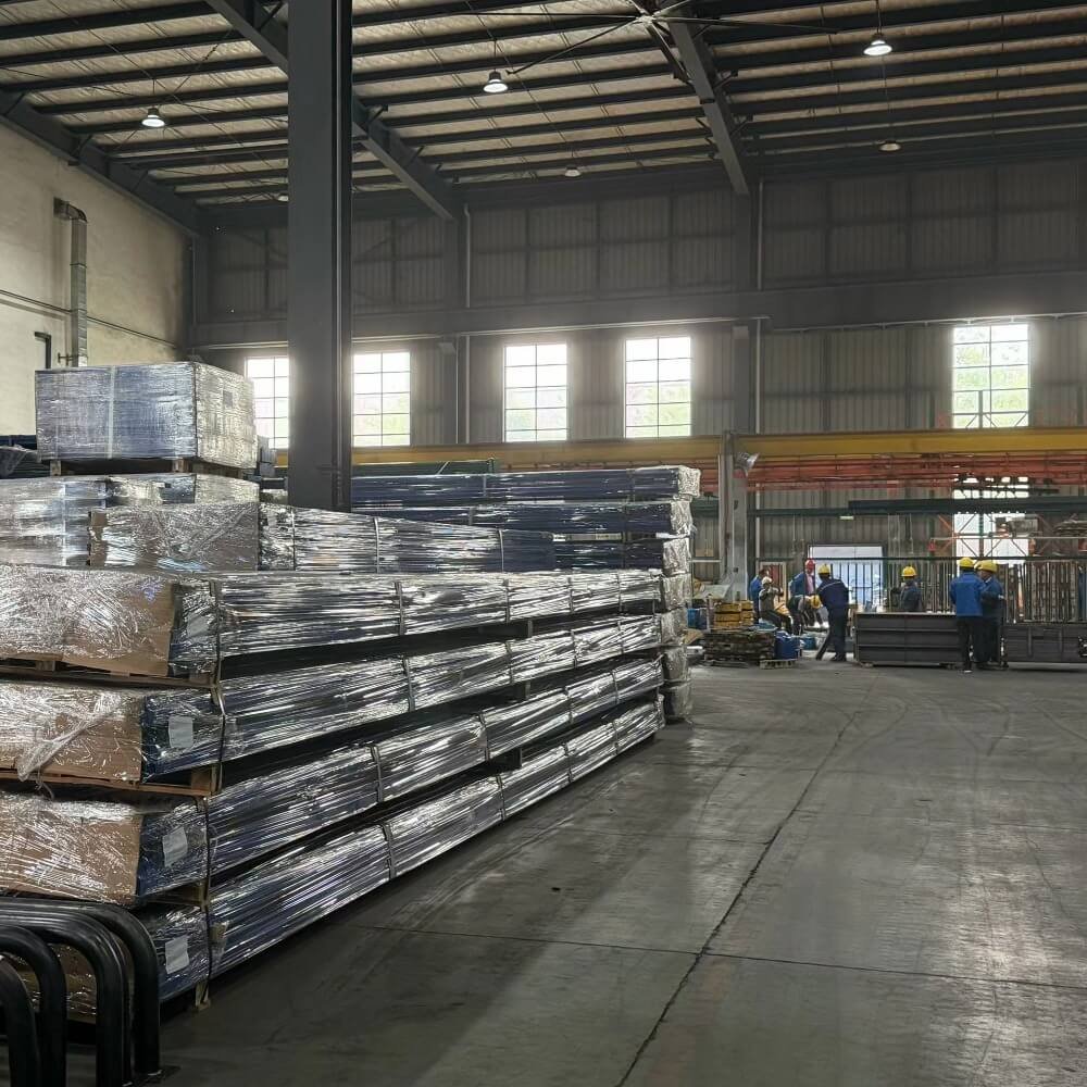 Factory workers operating on the active production floor of an industrial aluminum processing plant, showcasing in-house vertical supply chain capabilities.