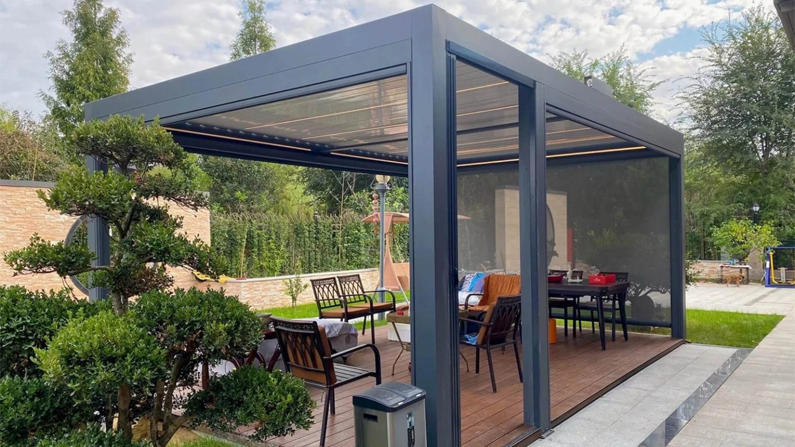 High-end custom bioclimatic aluminum pergola installation featuring integrated LED lighting and zip screens, showcasing our premium outdoor living solutions for custom B2B projects.