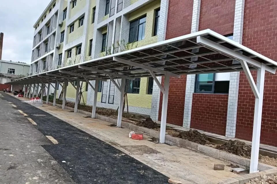 Heavy-duty e-bike carport structure featuring a white powder-coated aluminum frame and tinted polycarbonate roof panels for optimal UV and rain resistance.