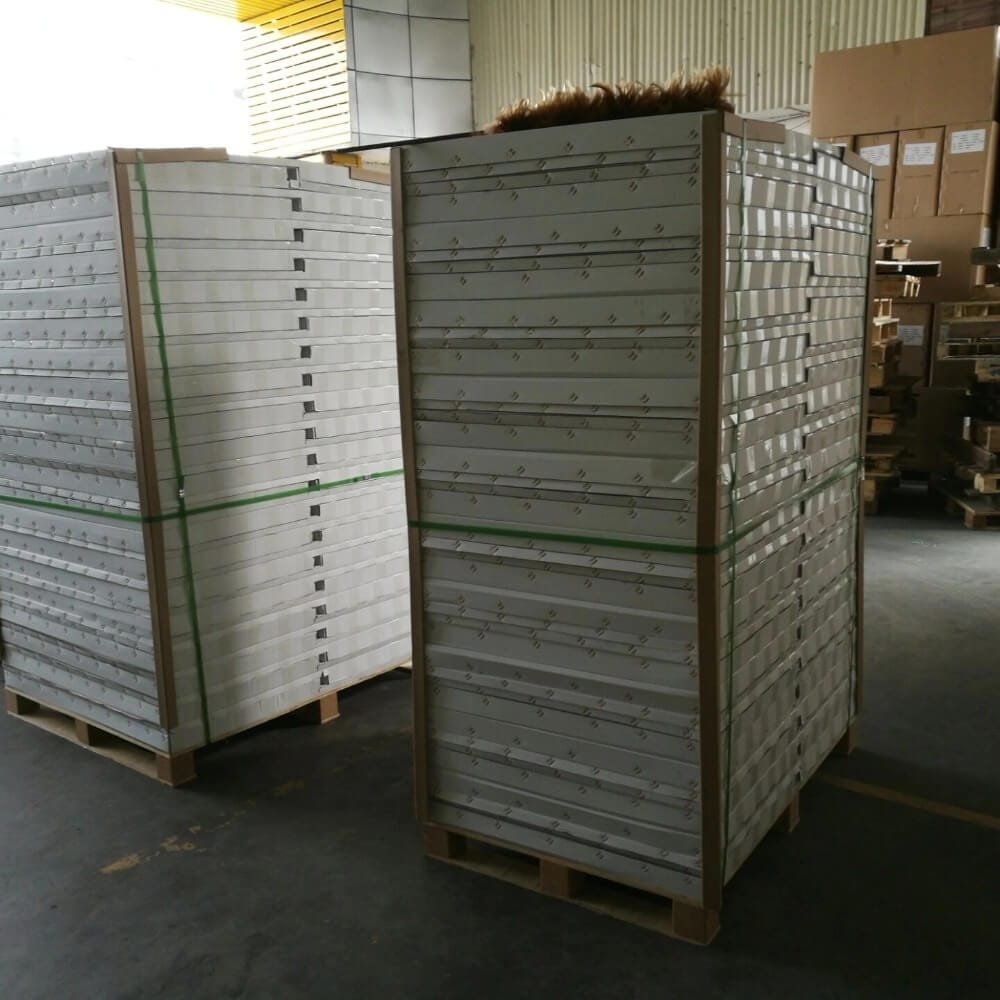 Heavy-duty export packaging of pergola components securely strapped on wooden pallets with reinforced corner protection in our warehouse, ensuring safe and crash-proof global transit.
