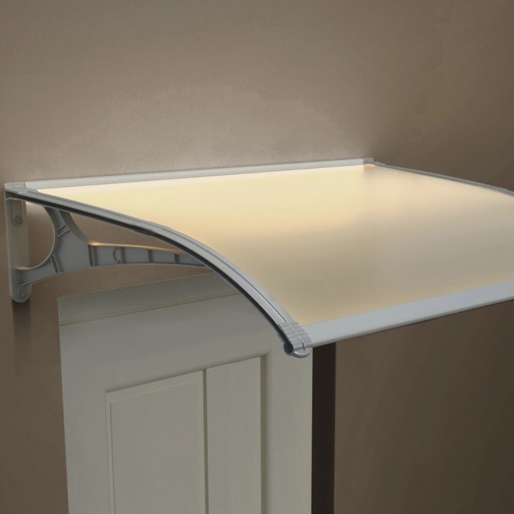 Frosted polycarbonate door canopy featuring integrated ambient LED strip lighting, illuminating a residential entryway with a warm glow at night.