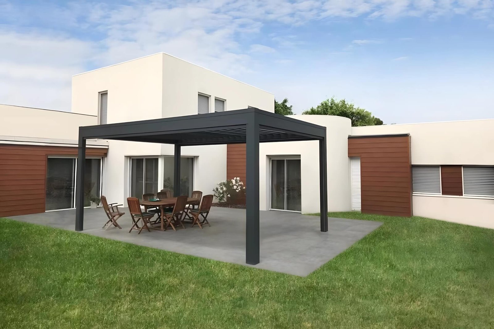 Modern dark grey freestanding aluminum bioclimatic pergola providing shade for an outdoor dining patio in a luxury residential backyard. Explore our complete range of premium outdoor shading systems for global distributors.