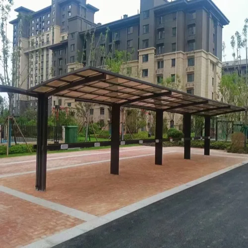A heavy-duty Y-shape double aluminum carport system installed in a commercial parking lot, providing maximum coverage for multiple vehicles with a central pillar structure.