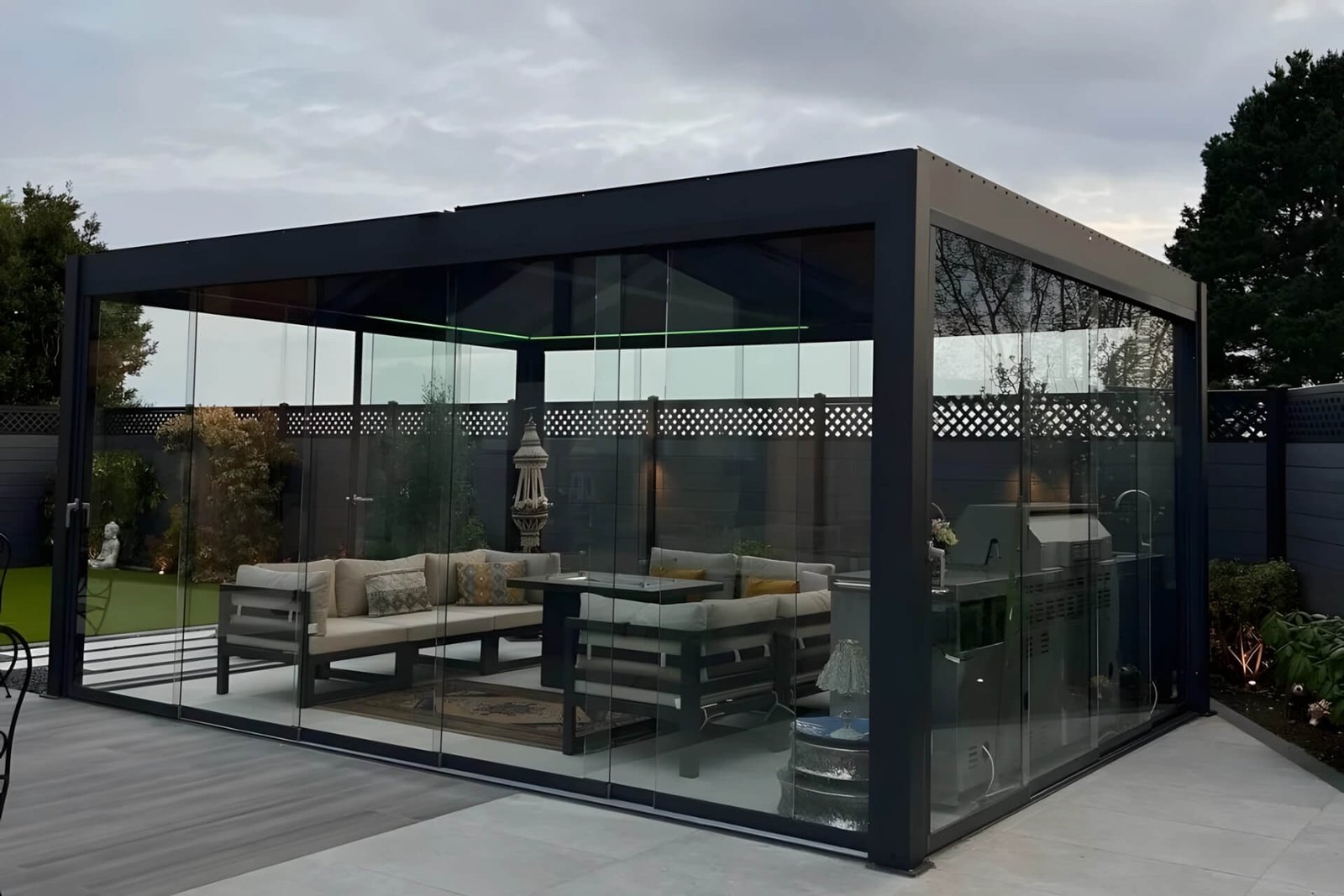 luxury backyard oasis featuring a custom aluminum bioclimatic pergola with frameless glass doors