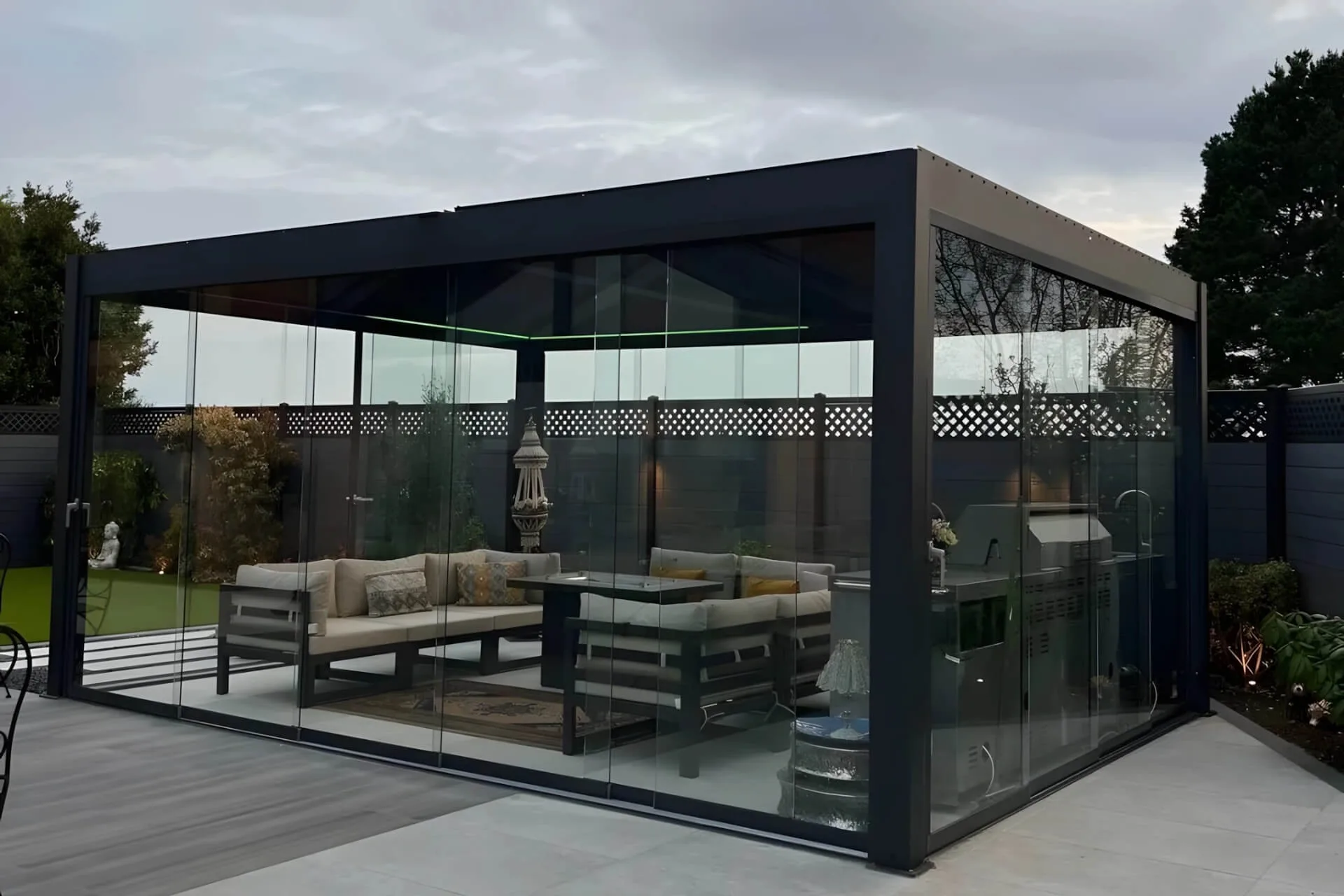 luxury backyard oasis featuring a custom aluminum bioclimatic pergola with frameless glass doors